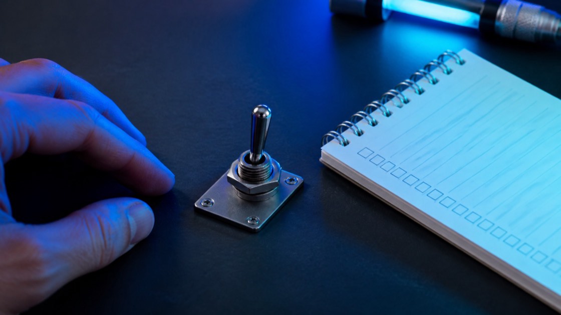 A photographed Windows support workspace for manage, with blue diagnostic light and no readable display